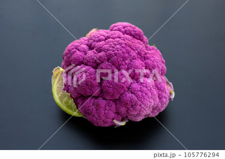 Purple cauliflower on dark background. Purple cauliflower on dark background. 105776294