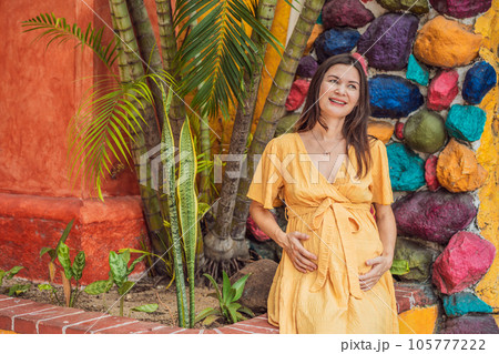 A strong and resilient woman over 40 embraces the beauty of childbirth in Mexico, celebrating the journey of motherhood with cultural richness A strong and resilient woman over 40 embraces the beauty of childbirth in Mexico, celebrating the journey of motherhood with cultural richness 105777222