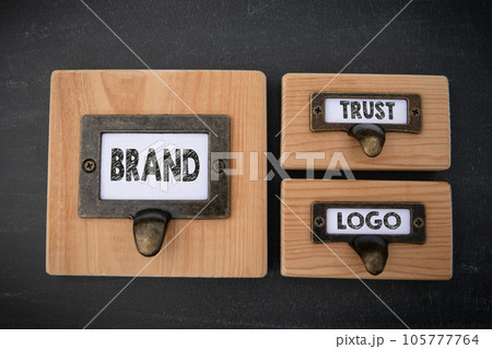 Brand Trust Logo Concept. File cabinet label. Dark gray background Brand Trust Logo Concept. File cabinet label. Dark gray background 105777764