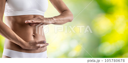 Middle part of female body with up and down hand gesture. A woman in underwear symbolizes a healthy lifestyle, a healthy stomach, menstruation or pregnancy Middle part of female body with up and down hand gesture. A woman in underwear symbolizes a healthy lifestyle, a healthy stomach, menstruation or pregnancy 105780678