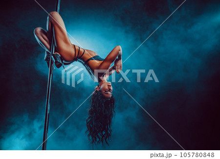 Young sexy woman pole dancing 105780848