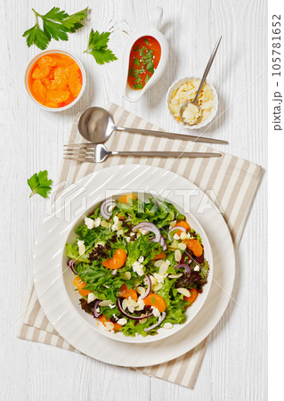 Mandarin Orange Salad in white bowl, top view 105781652