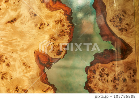 Top view of a tree as a background with space to copy. A wooden table covered with epoxy resin with a transparent space in the middle. High quality photo Top view of a tree as a background with space to copy. A wooden table covered with epoxy resin with a transparent space in the middle. High quality photo 105786888