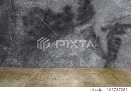 Wooden table with black wall 105787265