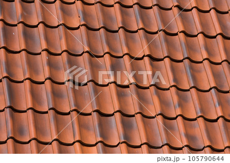 Red tiles roof background 105790644