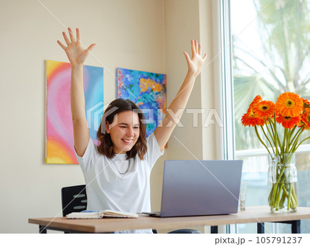 woman using laptop while working indoors woman using laptop while working indoors 105791237