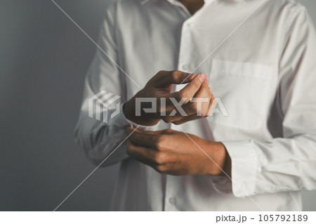 Closed up of businessman getting dressed isolate on white background. working concept. Closed up of businessman getting dressed isolate on white background. working concept. 105792189