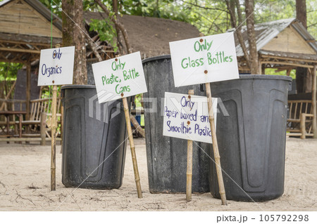 Waste separation on a beach in Thailand. Container for separate disposal of waste and garbage near the sea beach on the coast in Asia. Environmental protection and ecology care Waste separation on a beach in Thailand. Container for separate disposal of waste and garbage near the sea beach on the coast in Asia. Environmental protection and ecology care 105792298
