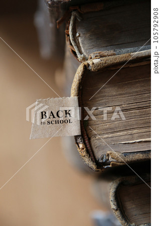 Back to school tag and Book on old wooden table. Back to school tag and Book on old wooden table. 105792908