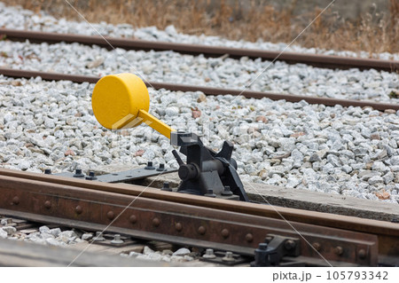 Yellow switch of railway tracks in day lighting 105793342
