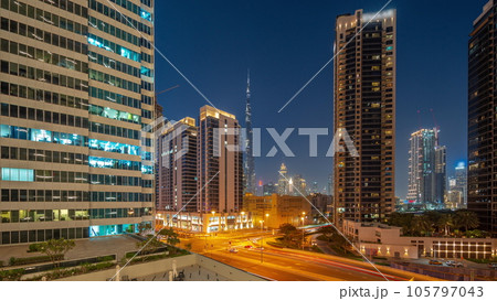 Aerial panoramic view to Dubai downtown and difc skyscrapers day to night timelapse. 105797043
