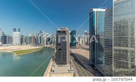 Cityscape skyscrapers of Dubai Business Bay with water canal aerial timelapse. 105797044