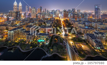 Skyscrapers in Barsha Heights district and low rise buildings in Greens district aerial day to night timelapse. Skyscrapers in Barsha Heights district and low rise buildings in Greens district aerial day to night timelapse. 105797080