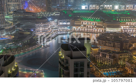 Dubai promenade singing fountains on the background of architecture aerial timelapse 105797081