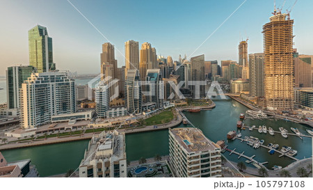 Panorama showing Dubai Marina skyscrapers and JBR district with luxury buildings and resorts aerial timelapse Panorama showing Dubai Marina skyscrapers and JBR district with luxury buildings and resorts aerial timelapse 105797108