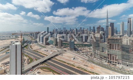 Panorama showing skyline of Dubai with business bay and downtown district timelapse. 105797215