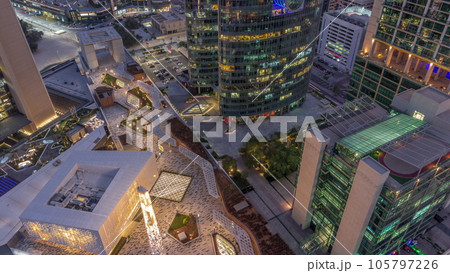 Dubai international financial center skyscrapers aerial day to night timelapse. Dubai international financial center skyscrapers aerial day to night timelapse. 105797226