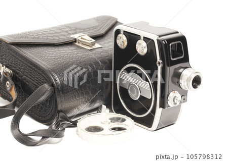 Vintage movie camera with filters and crocodile skin case isolated on white. 105798312