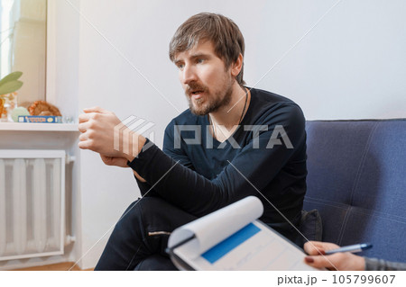 A person shares his problems with a therapist. Social issues, healthcare concept A person shares his problems with a therapist. Social issues, healthcare concept 105799607