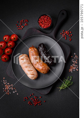 Delicious juicy sausages of several varieties grilled with salt, spices and herbs Delicious juicy sausages of several varieties grilled with salt, spices and herbs 105799771