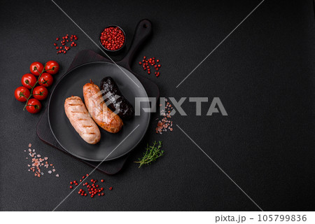 Delicious juicy sausages of several varieties grilled with salt, spices and herbs Delicious juicy sausages of several varieties grilled with salt, spices and herbs 105799836