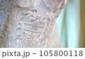 close-up, beautiful white lace on a dress, wedding dress 105800118