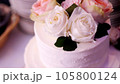close-up, snow-white cream three-story cake, decorated with roses. traditional wedding cake, wedding traditions, accessories. 105800124