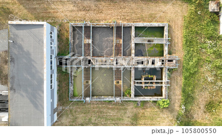 Wastewater biological purification waste water treatment plant old and rusty railing iron processes sedimentation, filtration, oxidation, water sewage treatment plant waste water bubbles tank Europe 105800550