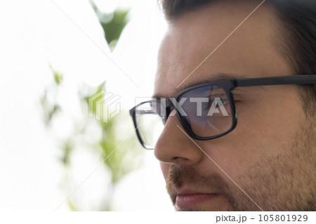 Face of thoughtful handsome adult man with stubble looking away Face of thoughtful handsome adult man with stubble looking away 105801929