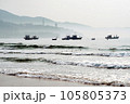 Boats floating near the beach in the brilliant dawn 105805373