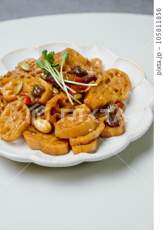 korean food yeongeunjorim, Braised Lotus Roots, Yeongeun (lotus root) parboiled and braised in a mixture of soy sauce and sugar over lower heat. Add syrup and braise to a glaze before serving. korean food yeongeunjorim, Braised Lotus Roots, Yeongeun (lotus root) parboiled and braised in a mixture of soy sauce and sugar over lower heat. Add syrup and braise to a glaze before serving. 105811856