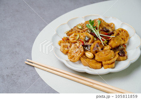 korean food yeongeunjorim, Braised Lotus Roots, Yeongeun (lotus root) parboiled and braised in a mixture of soy sauce and sugar over lower heat. Add syrup and braise to a glaze before serving. korean food yeongeunjorim, Braised Lotus Roots, Yeongeun (lotus root) parboiled and braised in a mixture of soy sauce and sugar over lower heat. Add syrup and braise to a glaze before serving. 105811859