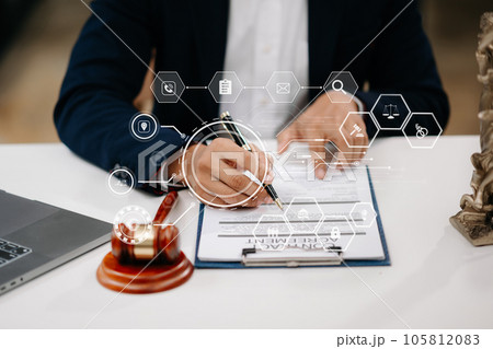 justice and law concept.Male judge in a courtroom the gavel, working with smart phone and laptop and digital tablet computer on wood table in morning light . justice and law concept.Male judge in a courtroom the gavel, working with smart phone and laptop and digital tablet computer on wood table in morning light . 105812083