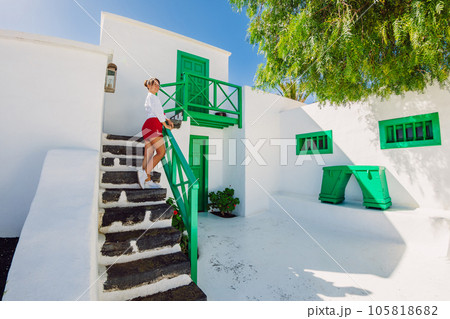 Woman posing with old historic architecture in Lanzarote 105818682
