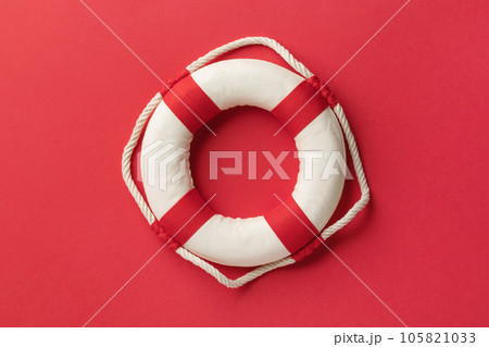 Lifebuoy on a red background, top view 105821033