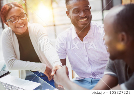 african business people handshaking at modern office 105827225