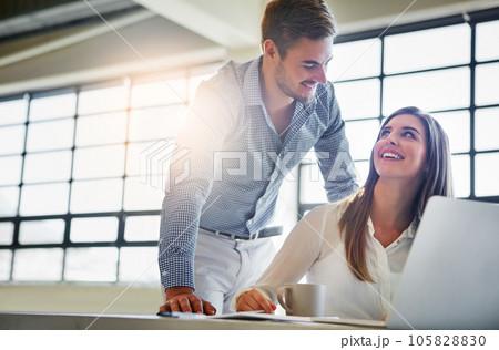 Training, coaching and business people with laptop in office workplace. Planning, manager and man helping woman on computer with advertising project, sales proposal or marketing strategy in company. 105828830