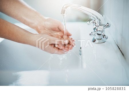 Woman, clean and washing hand with water at home for wellness, cleaning and hygiene in sink. Wash, hands and skincare to remove bacteria for self care, disinfection, health and safety at a house. Woman, clean and washing hand with water at home for wellness, cleaning and hygiene in sink. Wash, hands and skincare to remove bacteria for self care, disinfection, health and safety at a house. 105828831