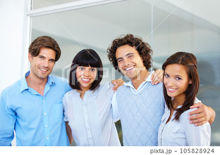 Business people, portrait smile and hug in teamwork for friendship, team building or success at the office. Happy and confident employees standing together smiling for company goals at workplace 105828924