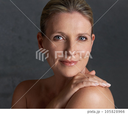 Portrait, skincare and senior woman with cosmetics, beauty and dermatology against studio background. Face, mature female person and old lady with salon treatment, hygiene and grooming with soft skin 105828966