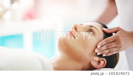 Woman, hands and face massage at salon for healthy wellness, skincare or stress relief in relax at resort. Hand of masseuse with calm female person relaxing in peaceful zen or facial treatment at spa Woman, hands and face massage at salon for healthy wellness, skincare or stress relief in relax at resort. Hand of masseuse with calm female person relaxing in peaceful zen or facial treatment at spa 105829072