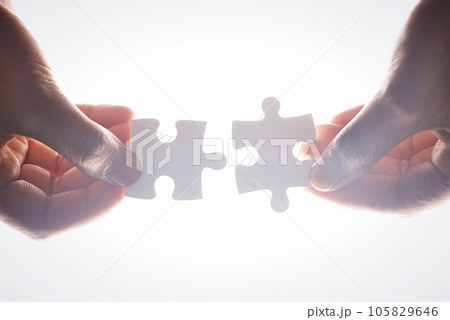 Puzzle, people hands and teamwork, integration or problem solving, collaboration and solution isolated on white background. Coworking, synergy and person or partner team building, support and below 105829646