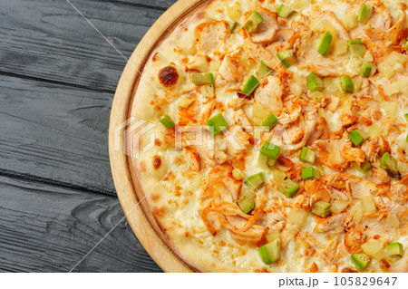 Fresh tasty pizza on black wooden background 105829647