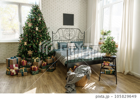 Cozy bedroom interior with winter Christmas decorations 105829649
