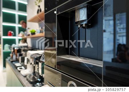 Row of many coffee machines on sale in store 105829757