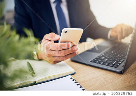 Phone, laptop and a business person with internet for research, information technology or contact. Hands of a professional man with a smartphone and notebook for planning, schedule or communication 105829762