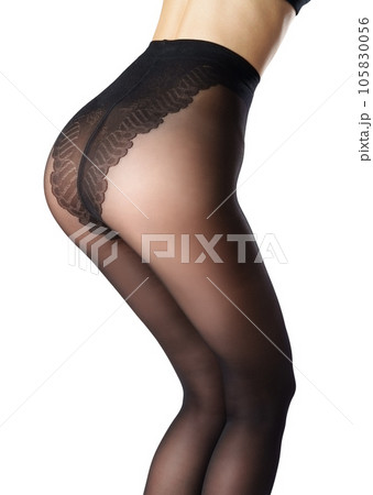 Legs of a woman in black capron tights on white background Legs of a woman in black capron tights on white background 105830056