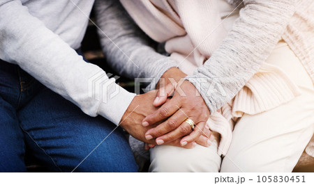 Holding hands, senior couple and support while together for empathy, love and care in marriage. Closeup of elderly man and woman with hope, respect and communication or kindness outdoor in retirement 105830451