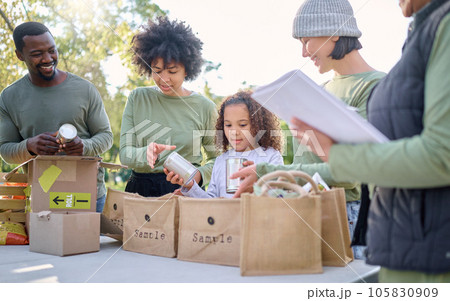 Volunteering, charity food and team with child for sustainability, poverty help and community service in nature. Group of happy people helping in teamwork with meal in support for sustainable society 105830909