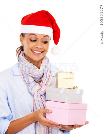 Woman, happy and Christmas presents in studio for festive celebration, gift giving and isolated in white background. Female, happiness look and celebrate holiday with xmas party gifts and santa hat Woman, happy and Christmas presents in studio for festive celebration, gift giving and isolated in white background. Female, happiness look and celebrate holiday with xmas party gifts and santa hat 105831377